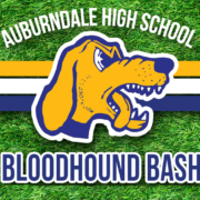 Logo of the Auburndale High School Bloodhounds with grassy background